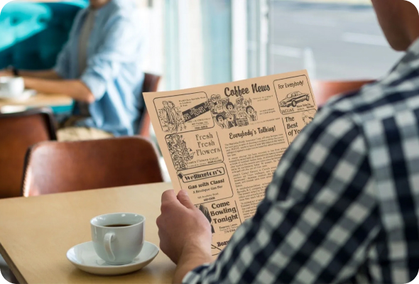 Man reading Coffee News publication